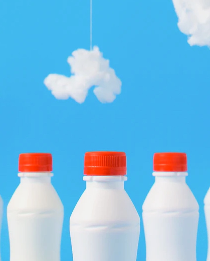 Milk bottles with sky background